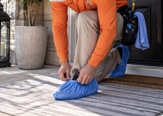 Neatly organized professional cleaning equipment on a tidy residential walkway